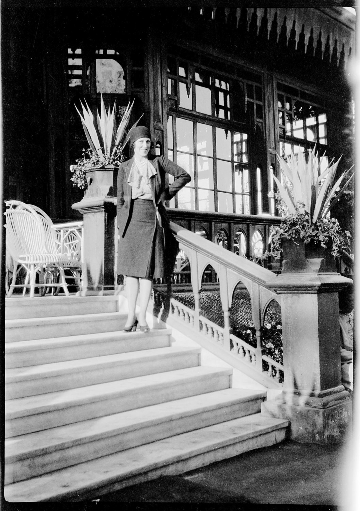 Dora-Sheller-on-the-steps-of-the-Mena-House-hotel-Cairo_Caroline-Simpson-Library-Research-Collection_Sydney-Living-Museums--721x1024